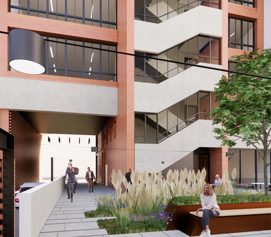 Widok budynku, zielone otoczenia, ludzie